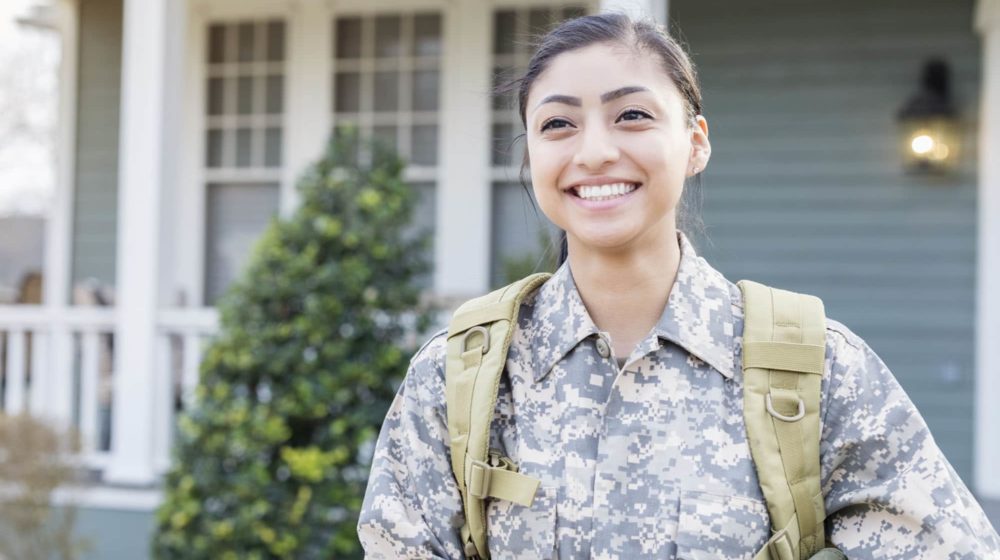 Excited female soldier leaving for deployment